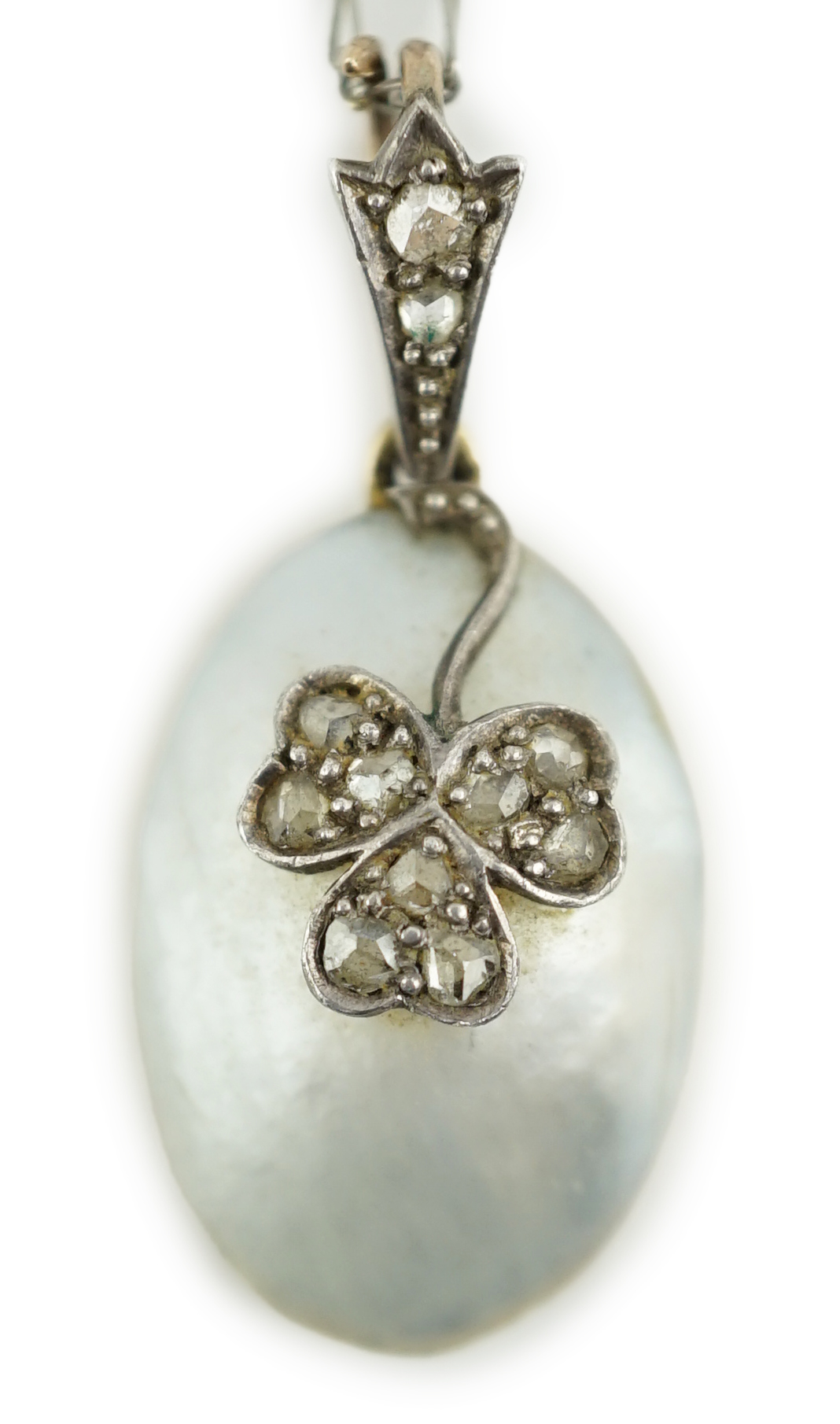 A 1920's gold and mabe pearl set oval pendant, with rose cut diamond set floral motif, on a platinum chain